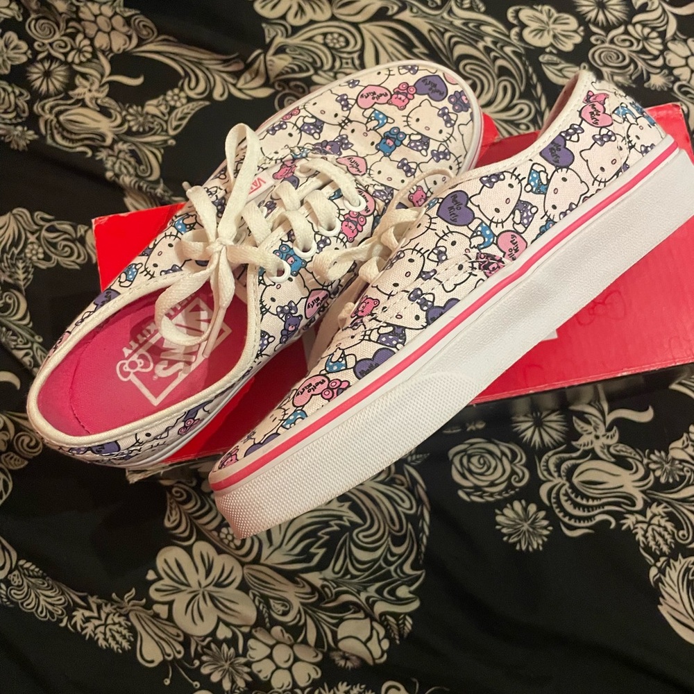 Hello kitty true white vans.